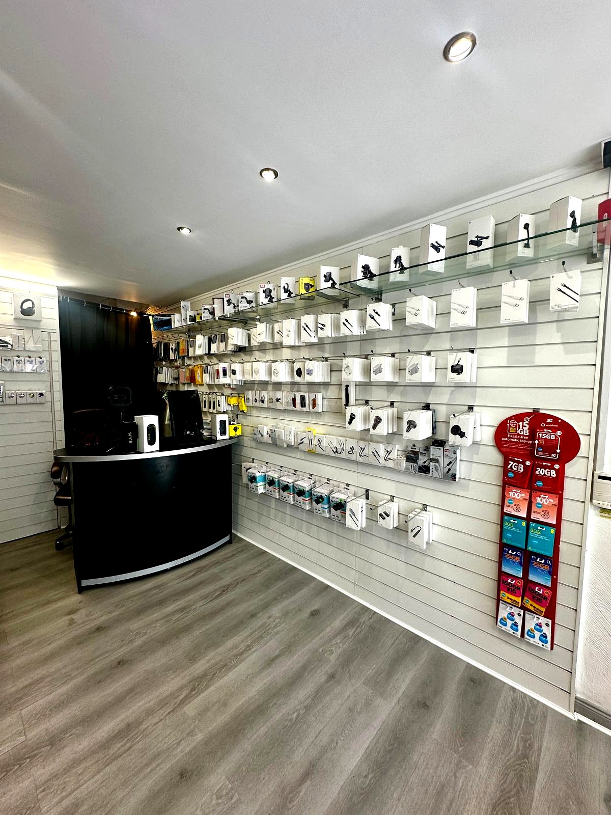 Inside Ness Top Shop — counter and accessories wall